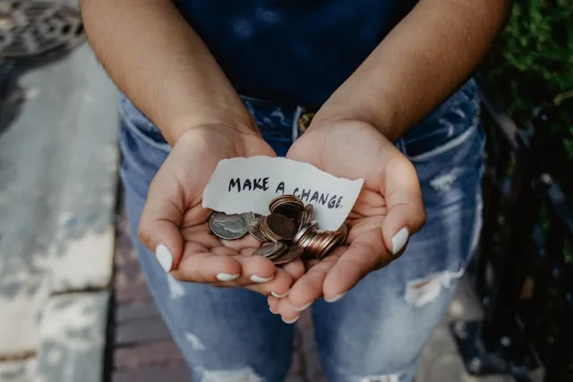hands holding change